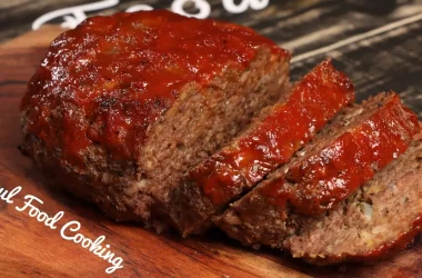 Homemade Southern soul food meatloaf with a tangy tomato glaze, sliced and ready to serve.