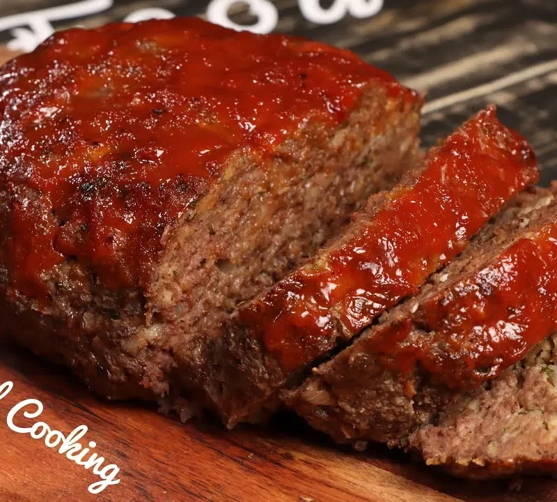 Homemade Southern soul food meatloaf with a tangy tomato glaze, sliced and ready to serve.
