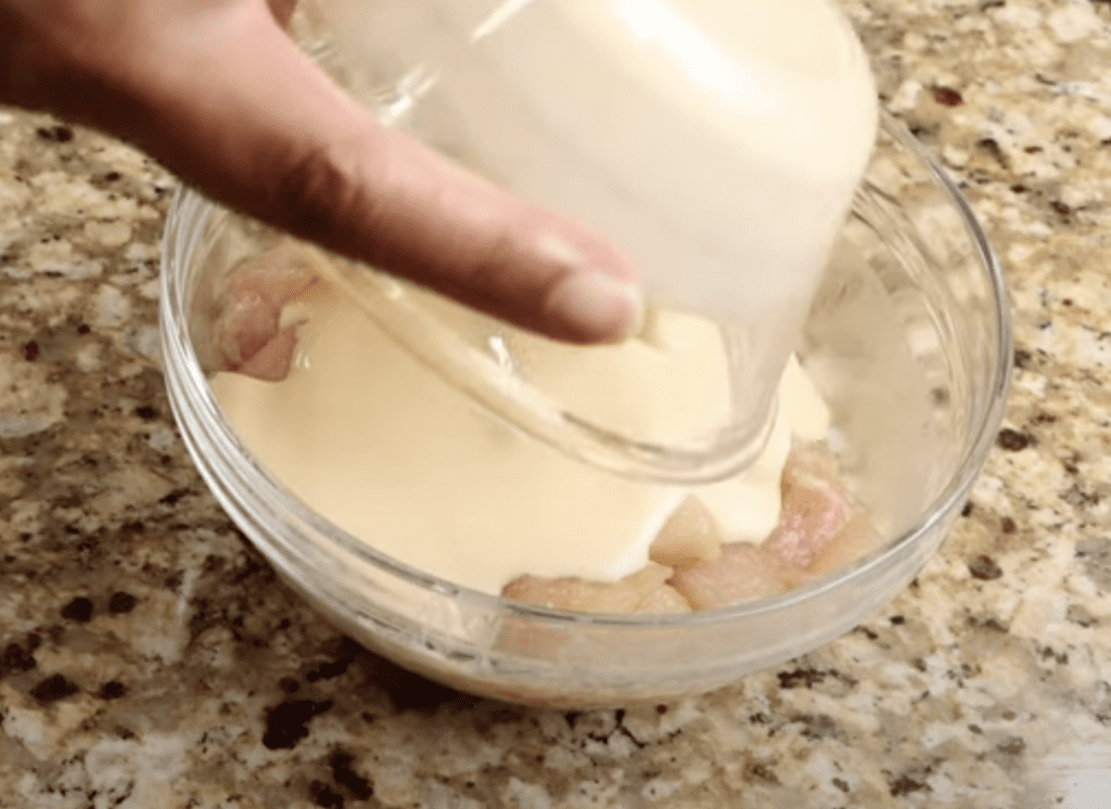 Coating the chicken with the batter