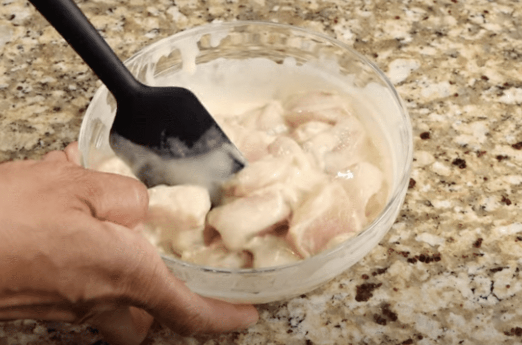 Coating the chicken with the batter