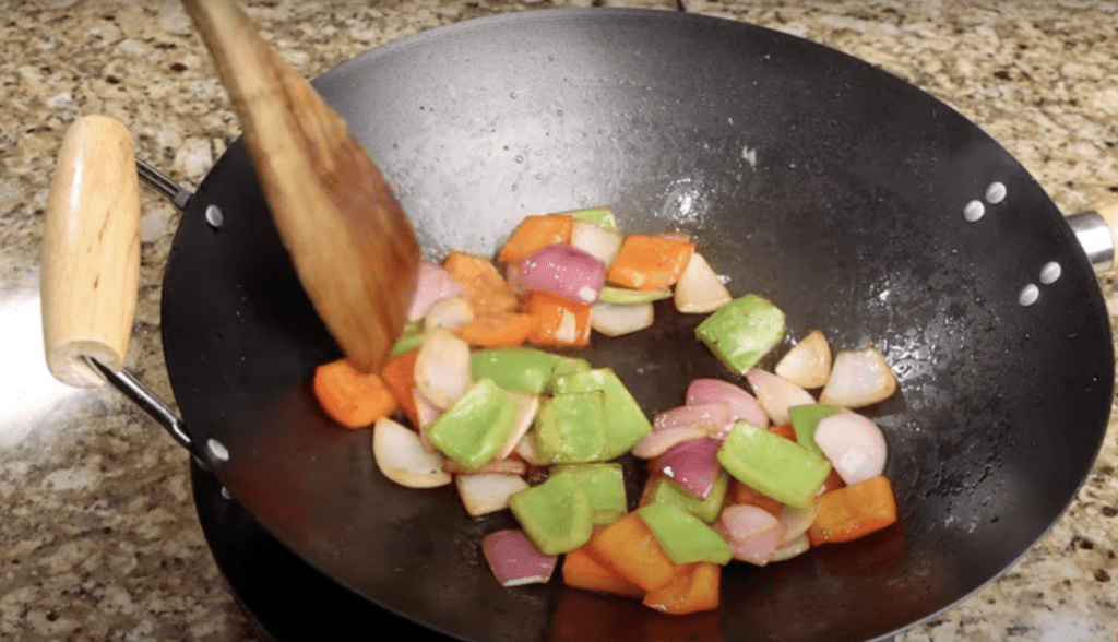 Saute bell pepper, pineapple and onion  for Sweet and Sour Chicken