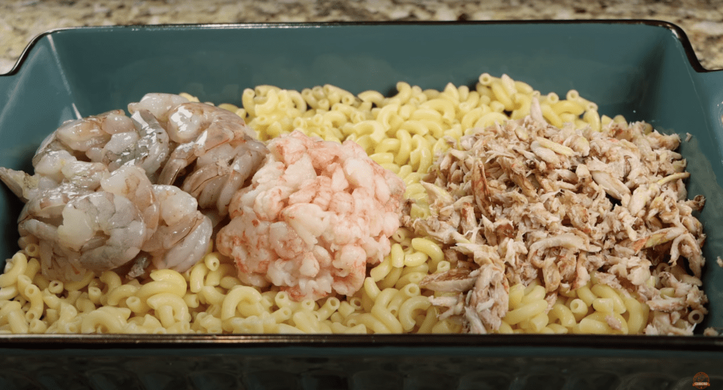 preparing the seafood mac and cheese