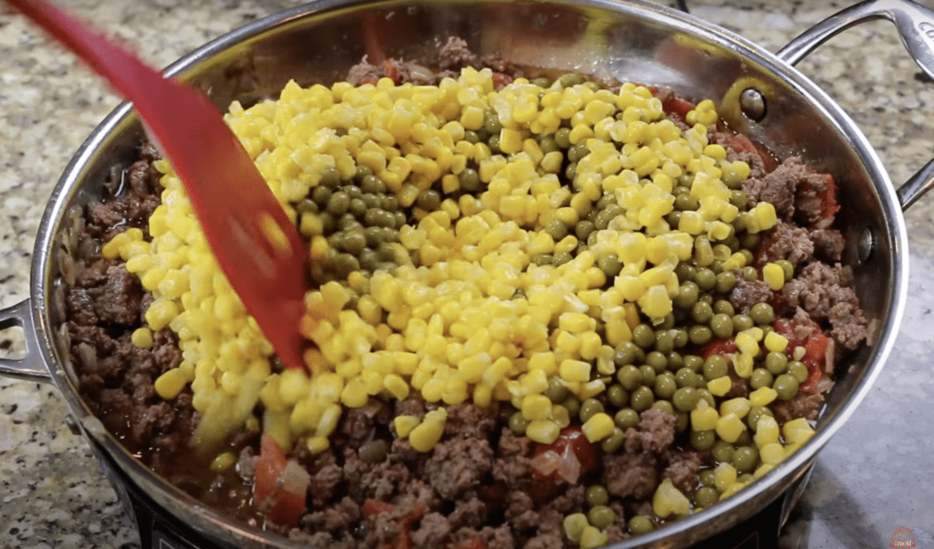 Tamale pie, corn, peas, ground beef, stewed tomatoes