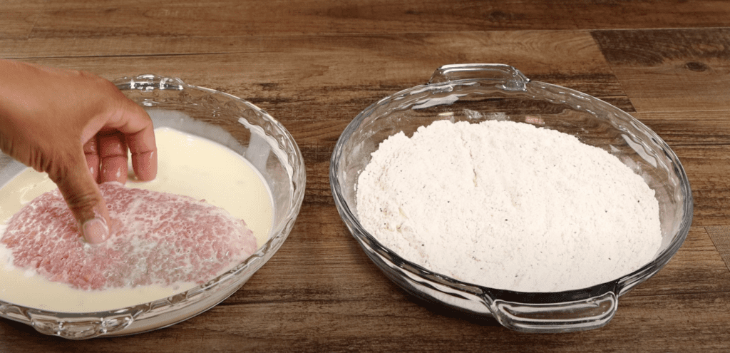 Dredging the steak in egg wash