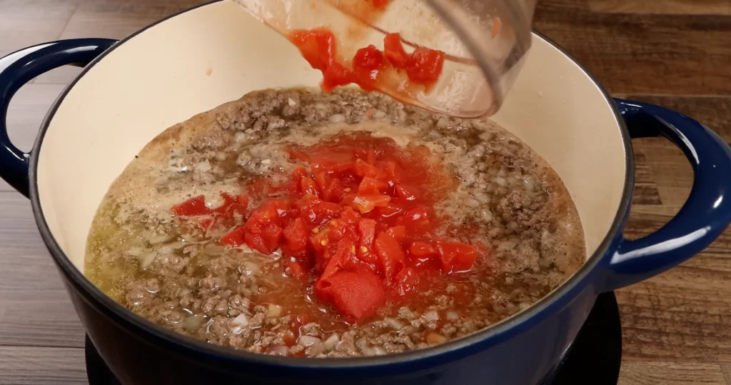 Adding Diced Tomatoes to Goulash