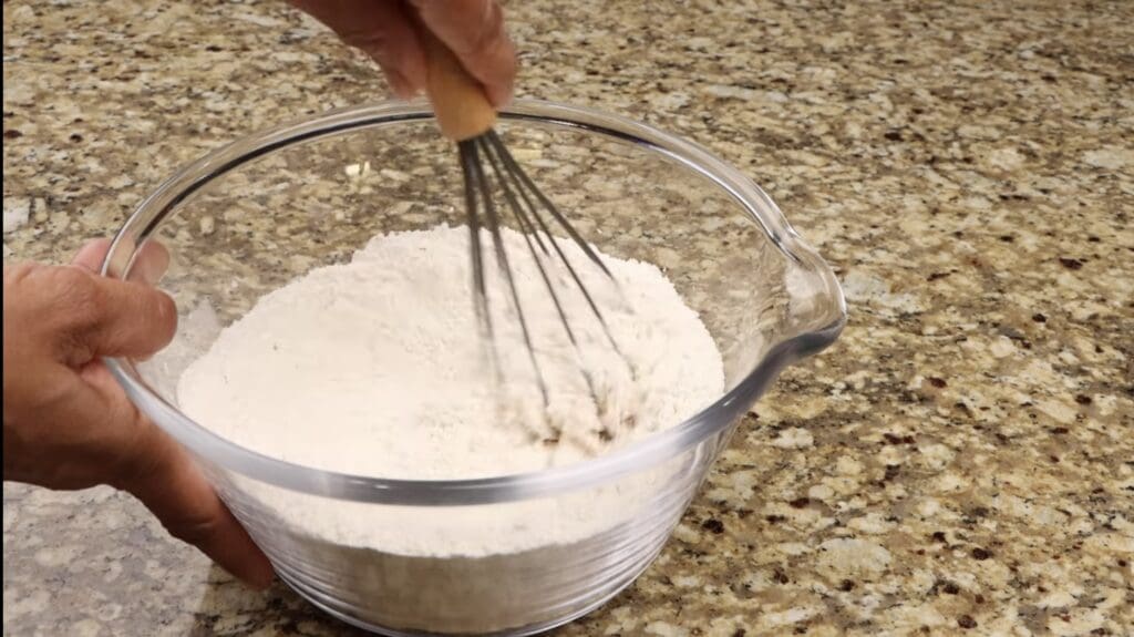 mixing the dry ingredients for the chocolate chip walnut cookies