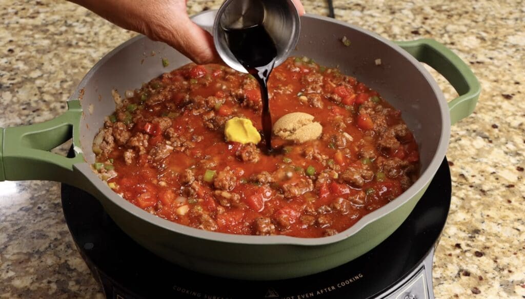 adding the mustard, brown sugar and worcestershire sauce to sloppy joe