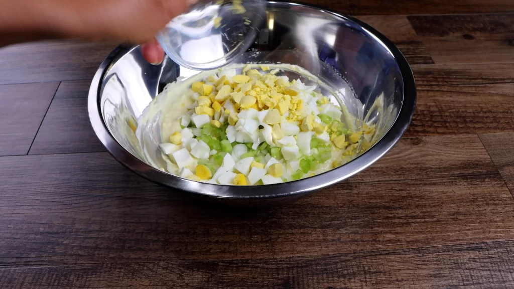 combining the ingredients for potato salad