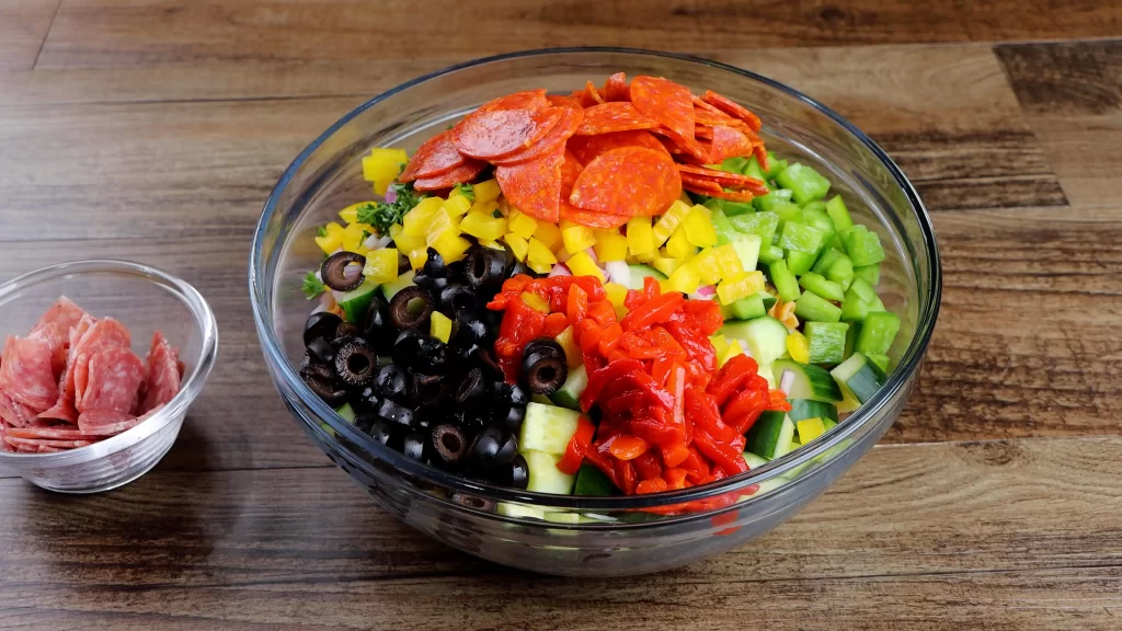 assembling pasta salad