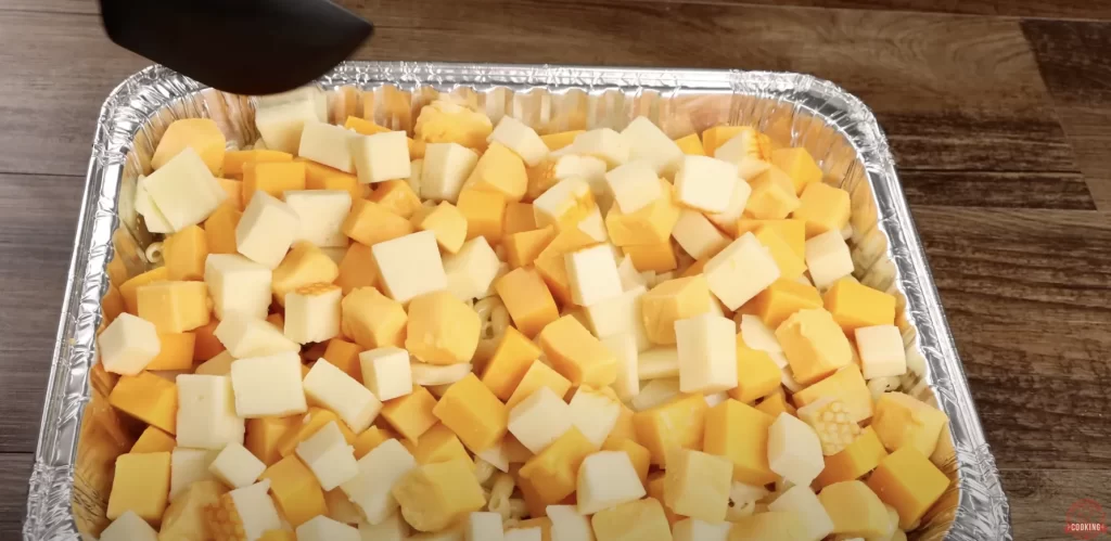 Add the cheese for the baked mac and cheese
