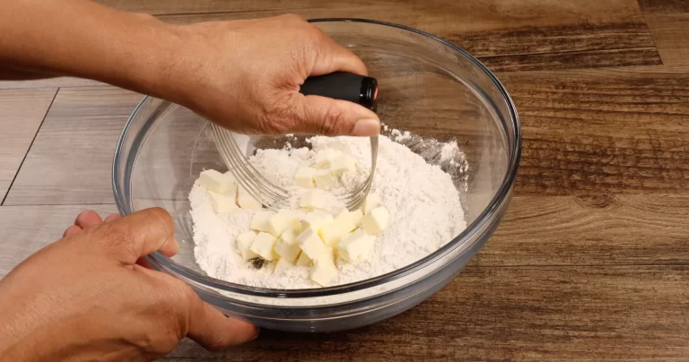 Cutting the Butter for Peach Cobbler Recipe